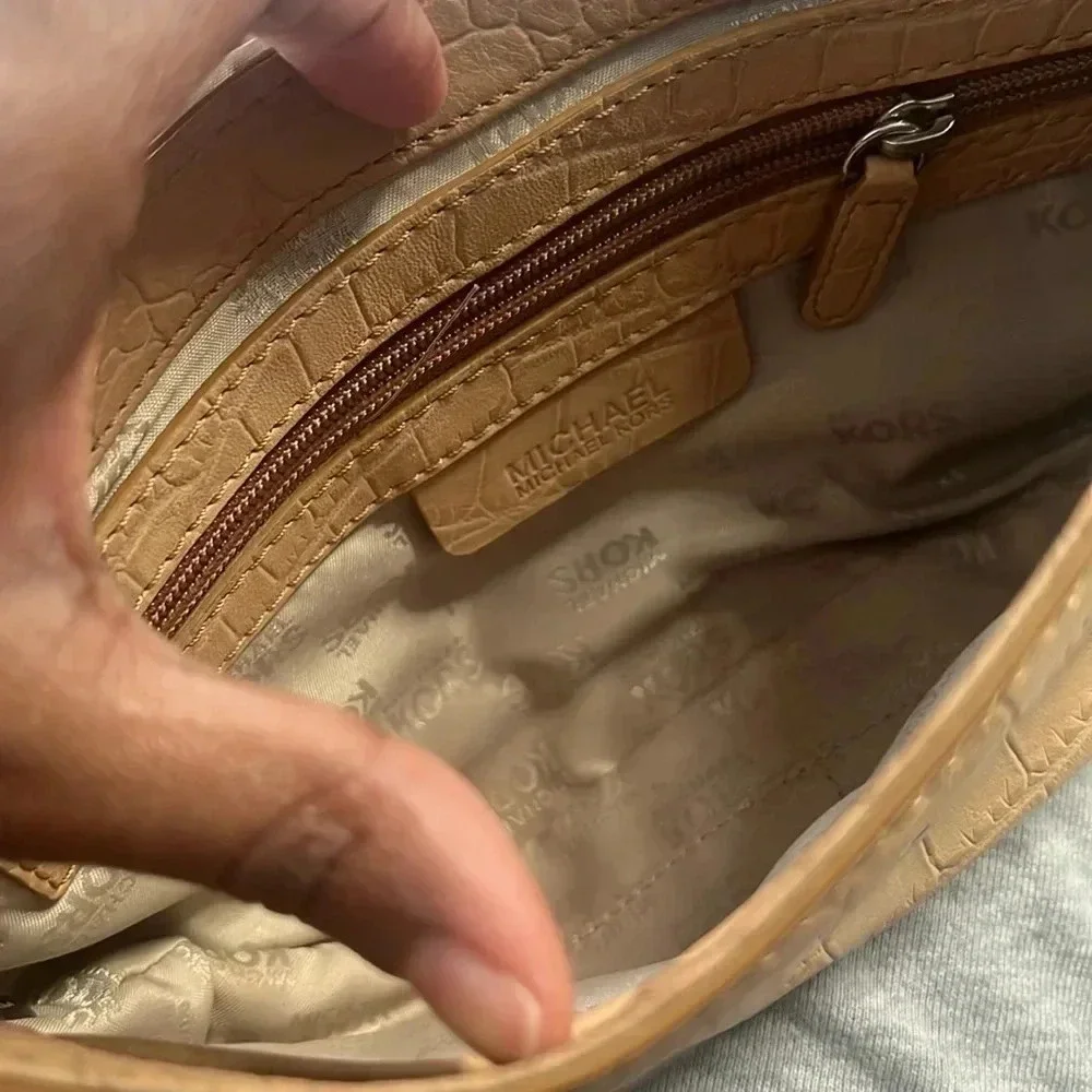 Tan Michael Kors envelope chain crossbody purse with adjustable straps